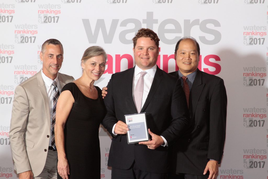 Archer accepting Best Cloud-Based Services Provider award from Waters